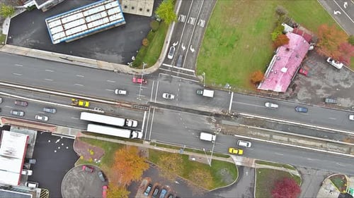 View From an Aerial Perspective Depicts a Busy Road Intersection During Rush Hour with Heavy Traffic