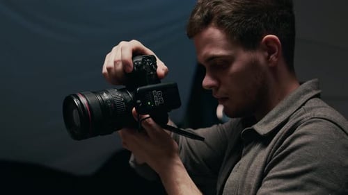 Male Photographer Taking Pictures of Female Model during Photoshoot in Studio