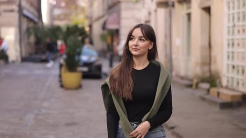 Stylish Woman Using Phone on City Street