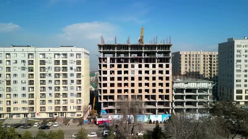 Drone flight around tall building construction
