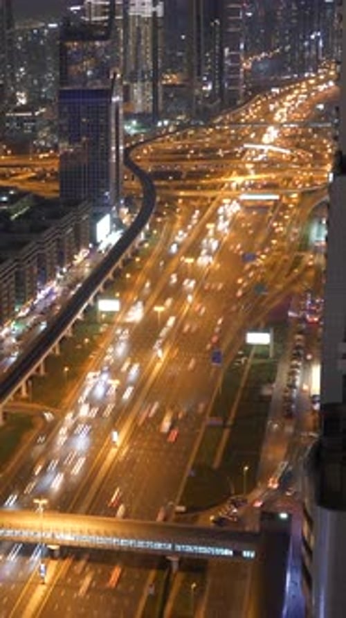 A Captivating City Nightscape Showcasing the Dynamic Flow of Traffic Throughout the Area