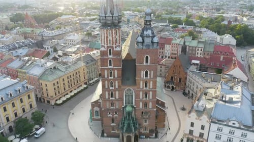 Cinematic Drone Flight Over St. Mary's Church in Krakow, Poland on Beautiful Day
