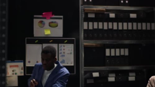 Colleagues Collaborate on Project in Office Workplace