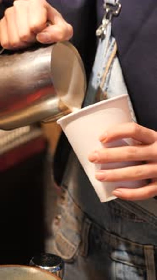 Latte Art Preparation by Young Adult Barista