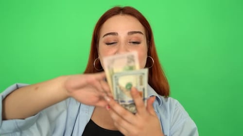 Woman Scattered American Dollars on Green Screen 4K