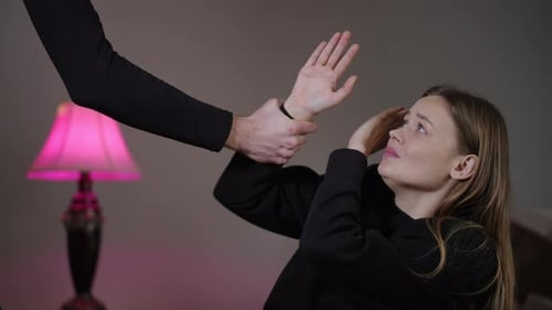 Scared Woman Defending Herself from an Assailant