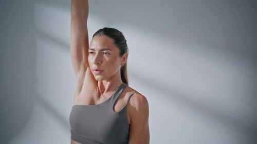 Strong Woman Lifting Dumbbell Pumping Biceps at Studio Closeup Lady Workout