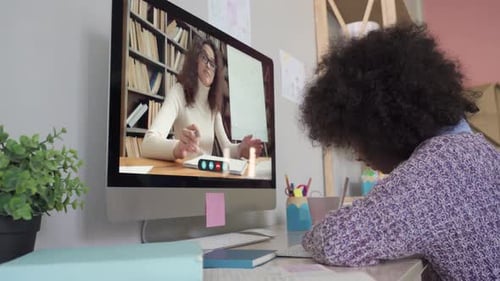 Mixed Race School Kid Girl Remote Learning with Online Tutor at Home