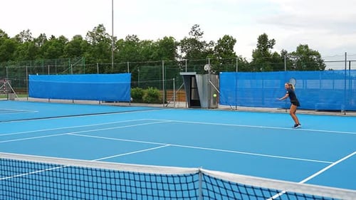 Professional Female Tennis Player Playing the Tennis on Outside Court