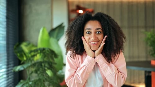 Portrait of a Cheerful Woman Showing Surprise Happiness with Energetic Gestures