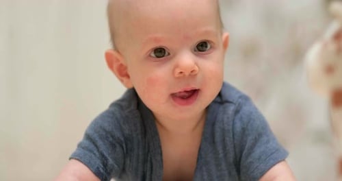 Adorable Infant Lying Down Indoors