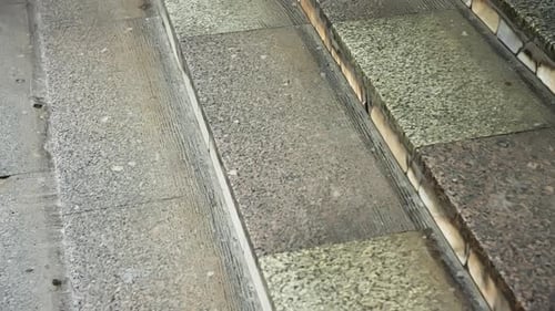 Closeup View of Weathered Stone Staircase Steps with Granite and Concrete Treads Textured Surfaces