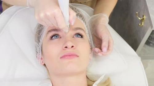 Closeup of a Woman Receiving Hydromicrodermabrasion Facial Peeling at a Cosmetic Spa Clinic