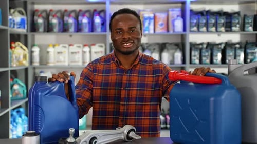 Portrait of African American Salesman in an Auto Parts Store The Concept of Car Repair