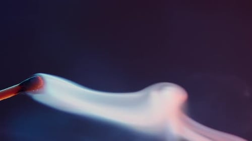 A Burning Match Goes Out and Leaves White Smoke