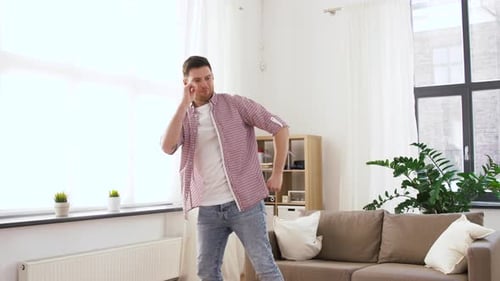 People and Fun Concept - Happy Young Man Dancing at Home Adult