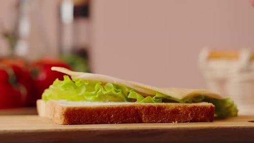 Preparing a Cheese and Lettuce Sandwich at Home