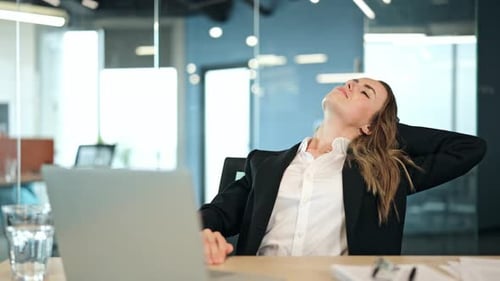 Businesswoman Relaxes During Office Work Break