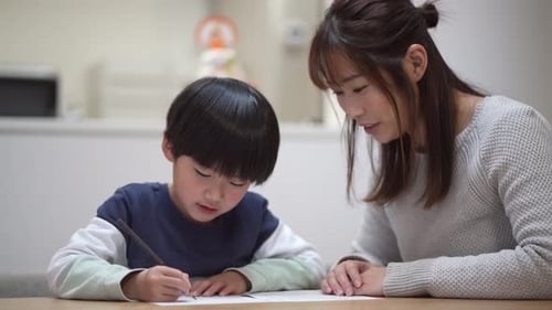 Parents and children practicing calligraphy