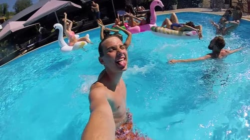 Lifestyle Blogger Man Taking Selfie Video with Action Camera in Swimming Pool Travel Vlogger Films