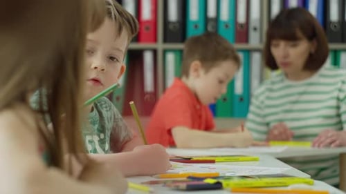 Children Work in a Lesson at School with a Teacher