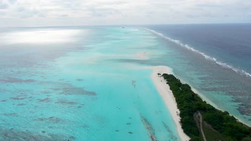 Aerial view of tropical island and beach, Maldives.