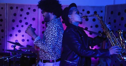 Young african musicians dance while mixing new album in South Africa recording studio