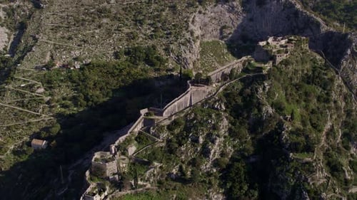 Aerial view of medieval fortress ruins overlooking Kotor Bay, Montenegro.