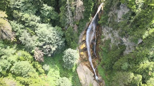 Aerial View of Waterfall Surrounded by Green Forest