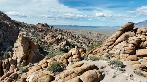 Aerial shot of interesting rock formations in the desert of California
