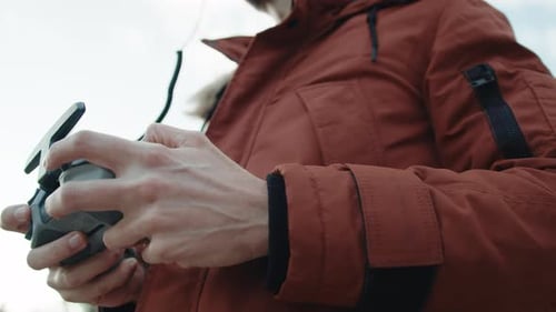 Man Using a Drone Remote Controller