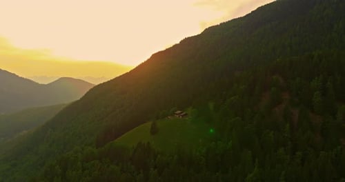 Drone Flies Over Green Picturesque Valley with Mountains in the Background High Mountains Famous