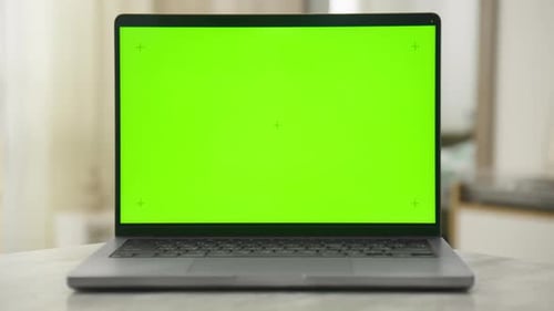 Laptop with Chroma Key Green Screen in a Modern Home Setting