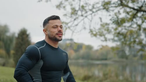 Outside Training Sporty Jogger Athlete is Running in the Park Morning Jog Sports Man in Black