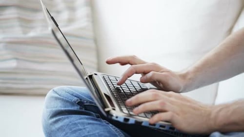 Technology, Home and Lifestyle Concept - Close Up of Man Typing On
