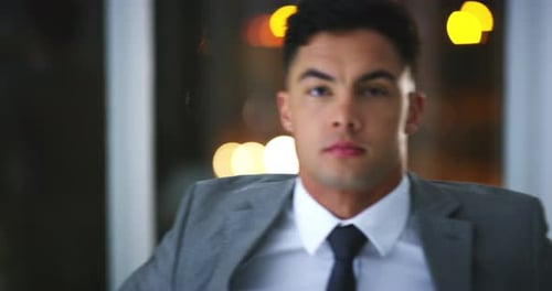 Face, serious and business man in office, confident or work on deadline at night in workplace