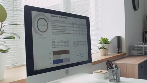 Computer Screen Showing Business Analysis Report in Office