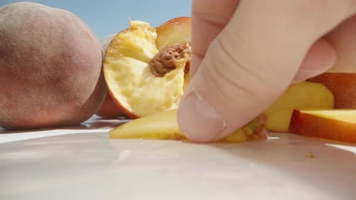 Arranging Slices of Peach Still Life