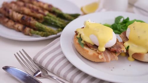 Breakfast Plate With Eggs Benedict and Grilled Asparagus