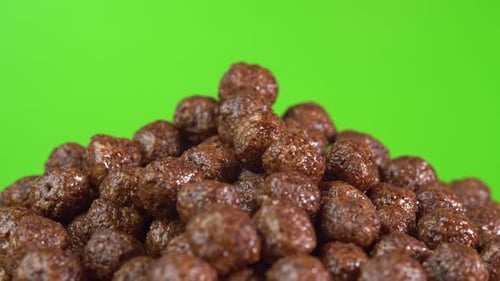 Chocolate Cereal Balls Piled High on Green Screen