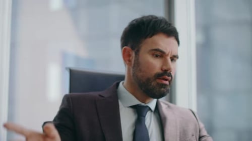 Frustrated Businessman Ends Angry Phone Call Indoors