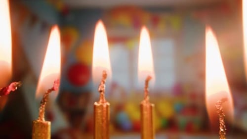 Woman Kid Child Blowing Candles on Birthday Cake Macro Close Up of Some Unlit Candles and Just One