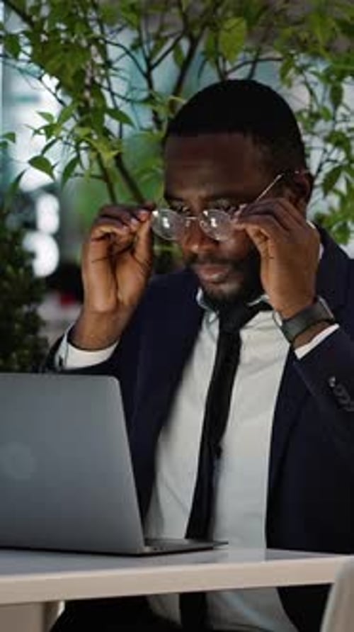 Business Man Working on Laptop in Urban Setting
