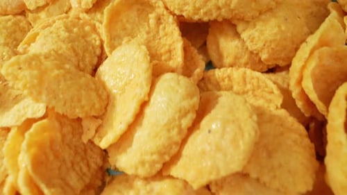 Macro Shot of Golden Crunchy Corn Flakes