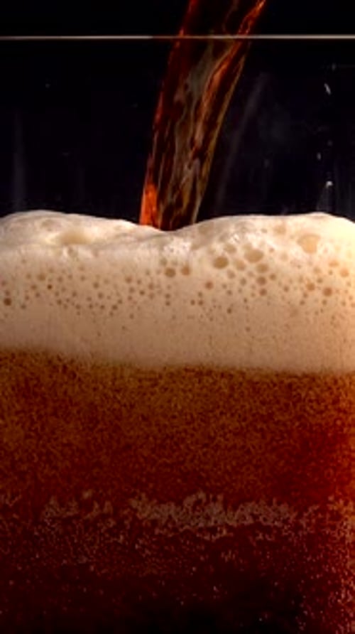 Experience Beer Poured in Slow Motion at 1000 Fps Showcasing Dynamic Bubbles and Foam in Stunning