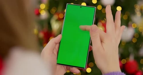 Smartphone with Green Screen in Festive Setting