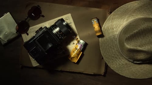Top View of an Outdated Analogue Photography Equipment a and Straw Hat