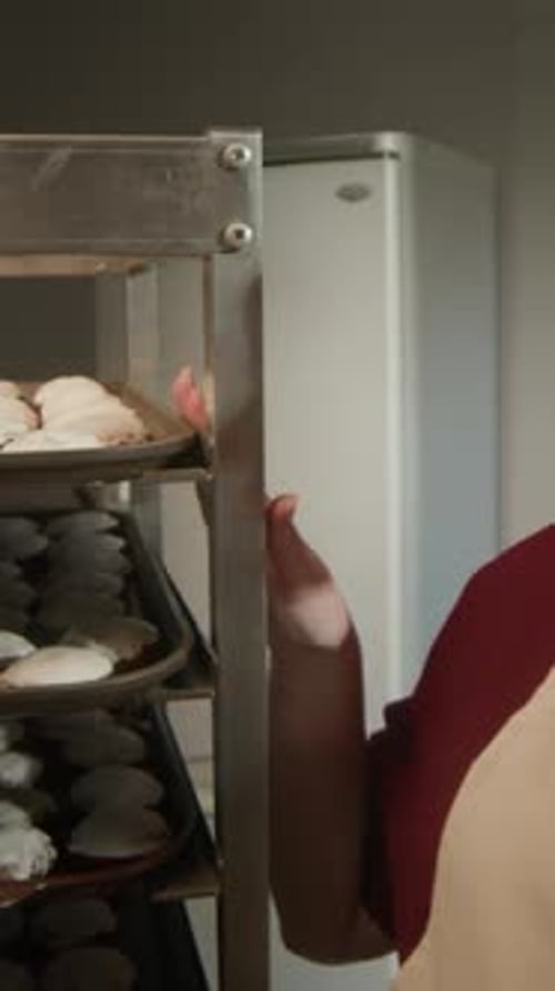 Woman in Apron Describing Cookies