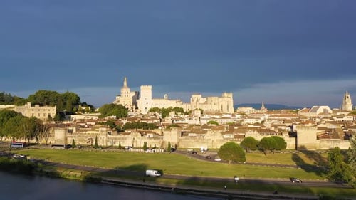 View of Avignon with Palais des Papes during sunset in Southern France. Medieval architecture along