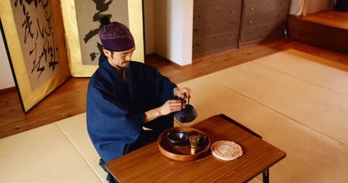 Man, tea ceremony and floor with with matcha pour for Japanese tradition with culture